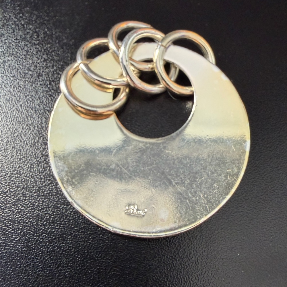 Modern Round Silver Pendant with Linked Rings